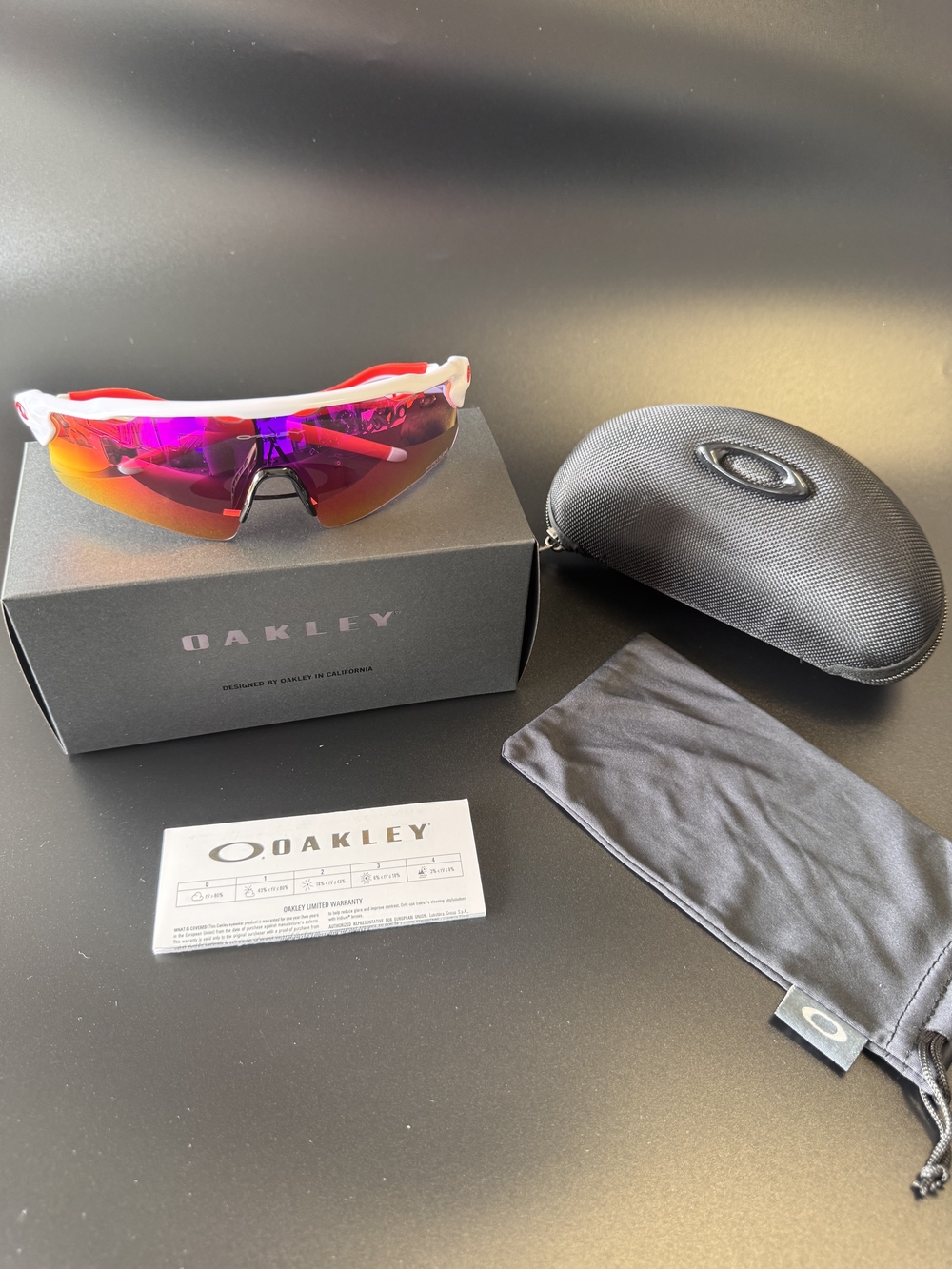 Oakley White Frame Sunglasses with Pink-Orange Mirrored Lens